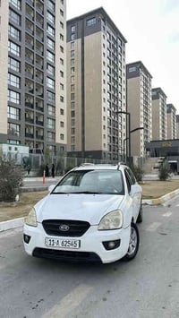 كيا كارينزا 2009 خليجي ماشيه 160  7 راكــب رقم انكليزي بغداد  محرك 200...