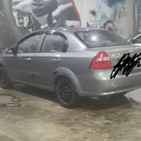 سيارة افيو موديل 2008 بيها طخه بسيطة الباب الي يم السايق والتكمه كير ت...