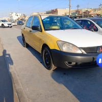 لانسر2009 للبيع  رقم بغداد سنوية 28  محرك بي تبخير  السعر 57وبيهة مجال...