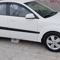 كيه برايد ٢٠٠٩ لون ابيض خليجي بسمي  محرك تبريد كير جاهز السياراه  ٠٧٨٠...