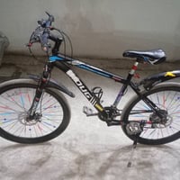 بايسكل رياضي ماركة WOUG  بايسكل جبلي كير 7 سرع & 3 حلقات يأتي مع الباي...