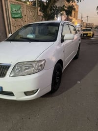 للبيع كورولا بيكاتشو ٢٠٠٦ رقم بغداد انكليزي  لون ابيض محرك ١٨٠٠ جديد ك...