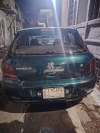 بيجو 307 • سيارة بيجو • لون زيتوني • كير اوتوماتيك • محرك شرط • تبريد ...