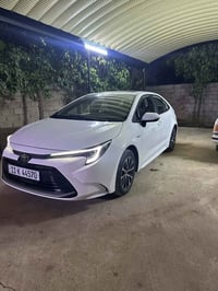 كورلا هايبرد. موديل ٢٠٢٥ للبيع. مكفولة كفالة عامة ممشى السيارة ٥ الف. ...