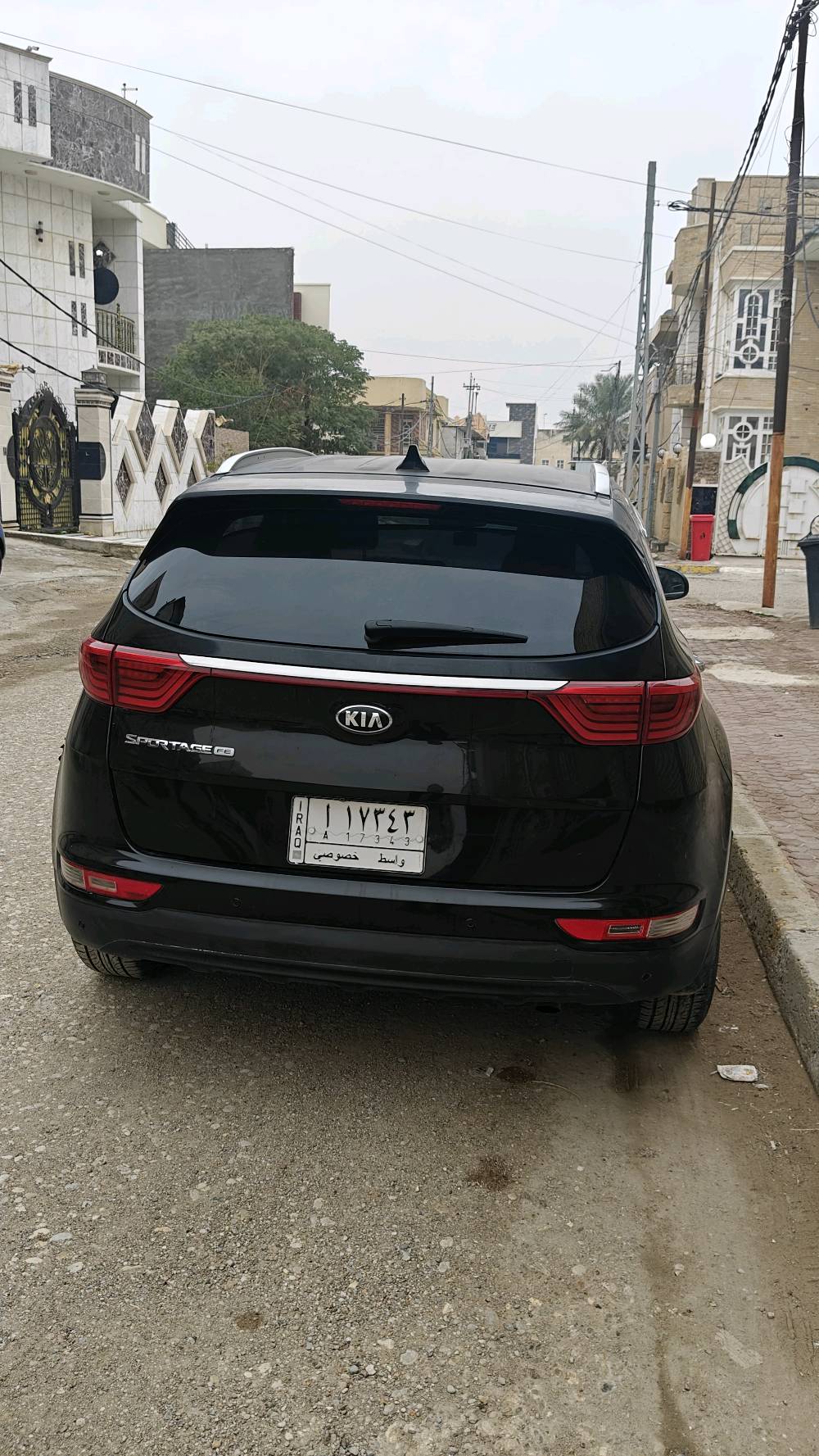 كيا سبورتج وارد امريكي ضرر باب لون اسود رقم واسط