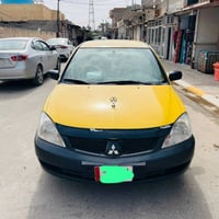 لانسر ٢٠١٠ • موتور ٢٠٠٠ • مصبوغة قدام وخلف
