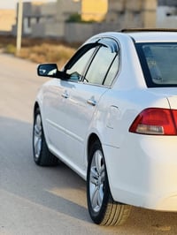 اوبتيما • ٢٠١٠ • مبدل امامي