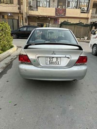 لانسر ٢٠٠٩ • رقم بغداد • كفالة مكينة وكير