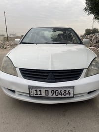 لانسر 2011 رقم بغداد ب اسمي كير اوتماتيك  سياره بيه ٣ قطع صبغ بدون دوا...