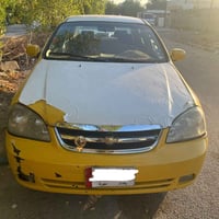 اوبترا 2010  رقم بغداد بيها طخه بالجاملغ الخلفي ومعمره مصفرة غرامات وه...