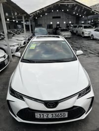 كورلا هايبرد 2025 فول مواصفات  داخل احمر 🔴 ارضيات حوضيه  سستم انارة مح...