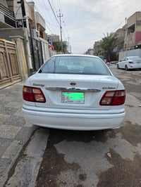 سني ياباني ٢٠٠١ كير عادي محرك وكير مكفولات رقم بغداد باسمي السيارة نظي...