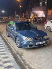 وبركاته سوناتا وفود مديل 2003 كير ومحرك 2000  لون ازرق رقم بغداد  السي...