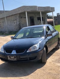 لانسر • ٢٠٠٤ • فتيس عادي