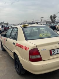 مازدا ٣٢٣ • تكسي • غاز وبنزين