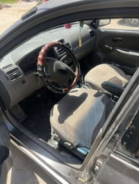 سياره ريو 2004 رقم بغداد سنويه ما ساقطه محرك حاويه   كير دي ما بيهه تن...
