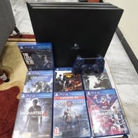 بلي ستيشن 4 برو مستعمل ما مفتوح مع جوستك واحد تجاري مع مجموعه العاب 11...