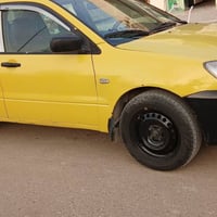 لانسر • ٢٠١٠ • طخه الخشم