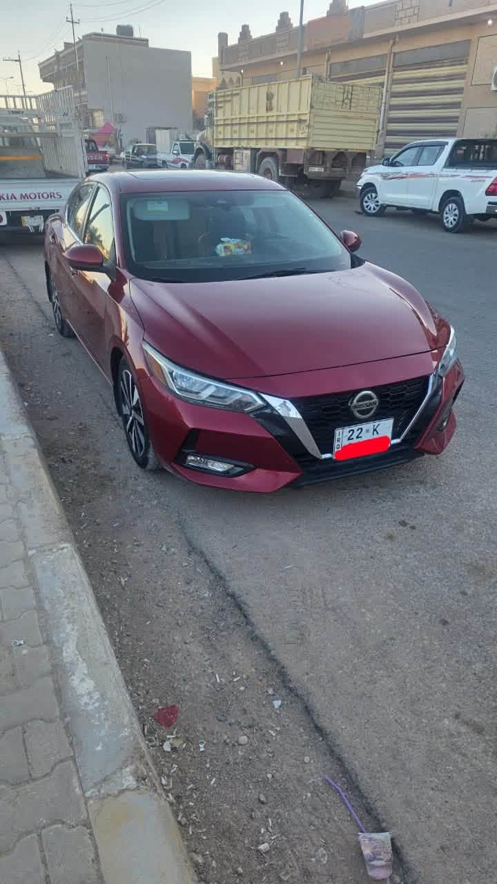 🚗 نيسان سنترا 2021 - SV (رقم اربيل  فول مواصفات)
اللون: ماروني
المحرك: 4 سلندر بسعة 2.0 لتر
كير: أوتوماتيك CVT
​فتحة سقف
​ تشغيل عن بعد + بصمة أبواب (دخول ذكي).
​رادار أمامي / مانع اصطدام مع فرملة طوارئ تلقائية.
 كشف النقطة العمياء 
​ تحديد وتنبيه الخروج عن المسار.
​رادار خلفي / فرملة طوارئ عند الرجوع للخلف.
​تثبيت سرعة ذكي  (Adaptive Cruise Control).
​شاشة لمس كبيرة تدعم Apple CarPlay و Android Auto.
​كاميرا خلفية دوارة
​تكييف مع تحكم مستقل السايق والراكب
​كوشن جلد كهربائي  تدفئة للمقاعد 
​ تحكمات ستيرن
​ويل كب ألمنيوم حجم 17./***********/بس شراي يدخل بله زحمه خوان رقمي بي واتساب
