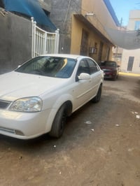 اوبترا موديل 2004 كير عادي .. رقم بغداد سيارة نصبتها حلوه جاهزه مكينه ...