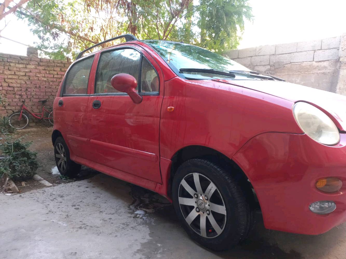    QQموديل 2013  بغدلد اوتماتيك ماشية 55لون احمر قطعه وحده صبغ بس البنيد 