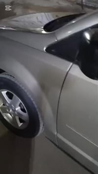 للبيع دوج كرفان 2009 لون اصفر ذهبي   بسمي بغداد حادث بدون  أرباك ولا د...