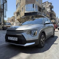 كيا نيرو 2023 للبيع فقط  3 قطع صبغ السونار ويا الصور رقم بغداد مكينه 1...