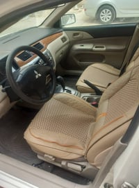 لانسر موديل 2012 باسمي هزه ورقم جديد تخم تاير جدد دسكات ودوشمه جديده ر...