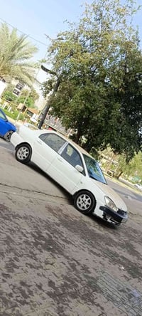 لانسر  أبيض للبيع موديل 2006 مصبوغه حزام ابيع عام   بيها ضربه بسيطة با...