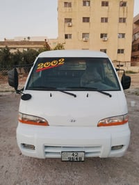باص • إتش 100 • ٢٠٠٢