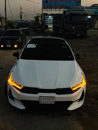 كي فايف K5 موديل 2022 جيتي لاين محرك 1600 توربو ‎اللون ابيض  رقم بغداد...