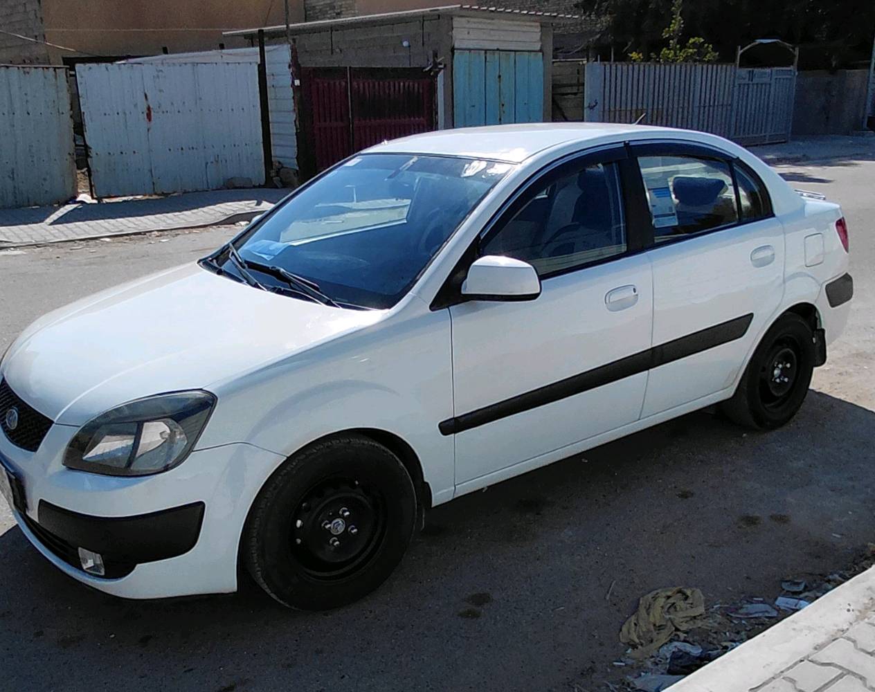 كيا ريو وارد أمريكي ٢٠٠٧  قطع مصبوغ ابيع حزام شاشه كامرة محرك وكير نظيف رقم دولي سنويه جديدة والسونار موجود للبيع ٦٨ ورقة مكاني بغداد الغزالية ***********