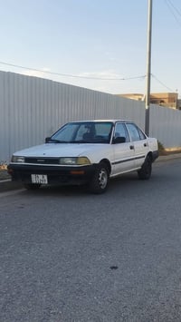 للبيع كورلا صدامي 1990 رقم جديد  انكليزي شرط التحويل  كير محرك شرط لات...