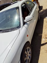 اكسنت ٢٠٠١بأسمي بغداد رقم انكليزي تبريد شغال المكينة بيها دخان سعرها(٤...