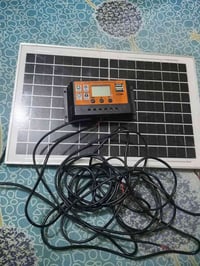 لوحة شمسية • ٣٥×٢٤سم • منظم شحن