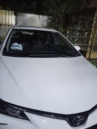 07773287772 كورلا  موديل 2024  هايبرد   ماشية40 الف   المواصفات   بصمة...