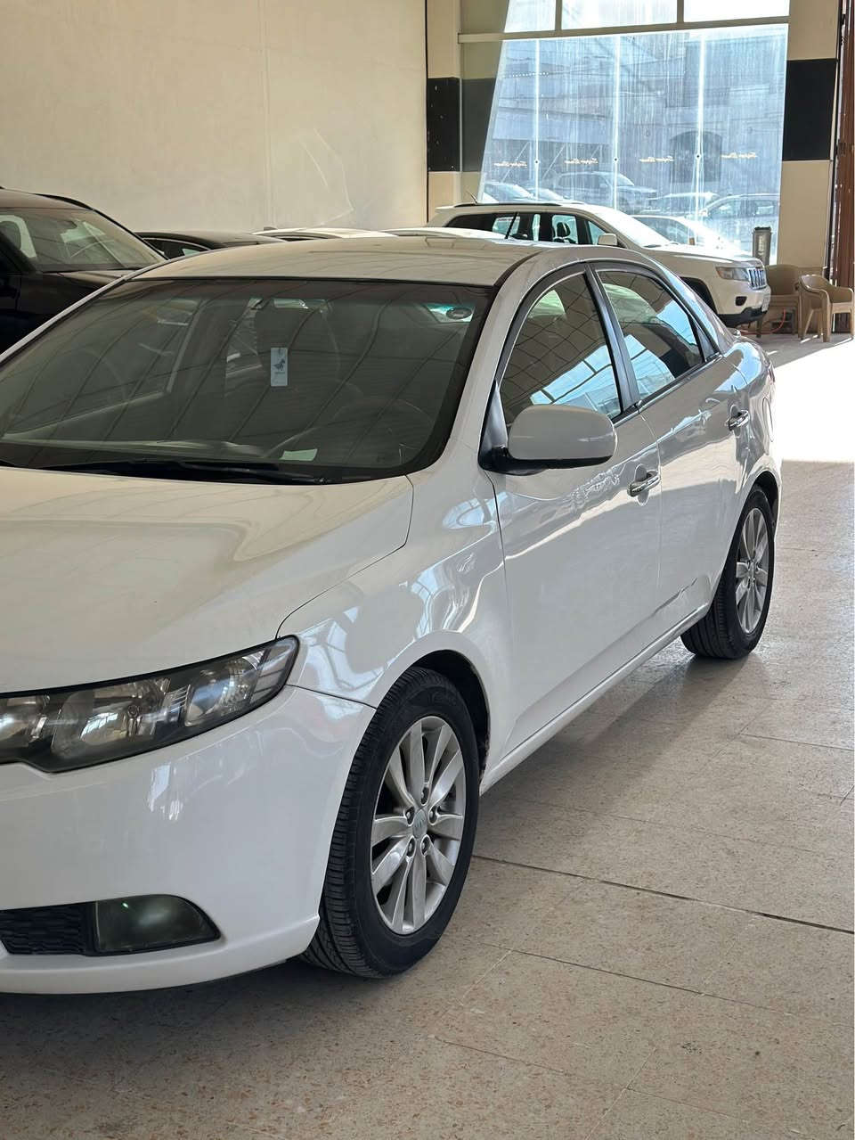 كيا سيراتو لون أبيض موديل 2012  صبغ بها قطعتين ربع رقم وسنويه منتهي كير ومحرك نظيف غرامات بها 100 دولار سيارة موجود زاخو تلفون *********** زاخو, دهوك
