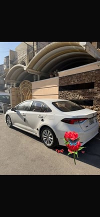 كورلا 2025 ماشي 2000 كشن كهرباء  سلايت داخل احمر جدا حلوه عنواني بغداد...