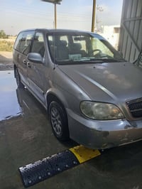 كيا كرنفال موديل 2004 رقم بغداد الإنكليزي الجديد سنوية بإسمي تحويل ثان...