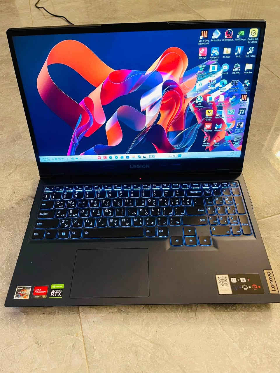 من رخصة الادمن 

* 🔹 الموديل: Lenovo Legion 5 15ACH6
* 🔹 المعالج: AMD Ryzen 5 5600H (6 أنوية / 12 خيط معالجة)
* 🔹 كرت الشاشة: NVIDIA GeForce RTX 3050 Ti

* ✅ تقنية Ray Tracing (تتبع الأشعة).
* ✅ DLSS لزيادة الفريمات في الألعاب المدعومة.
* ✅ DirectX 12 Ultimate.
* ✅ NVIDIA Reflex لتقليل تأخير الإدخال.
* ✅ NVIDIA Broadcast للبث وتحسين المايك والكاميرا بالذكاء الاصطناعي.
* ✅ NVENC Encoder للتسجيل والبث بجودة عالية مع استهلاك قليل للمعالج.
* ✅ تشغيل حتى 4 شاشات
* ✅ يدعم دقة 4K للشاشات الخارجية عبر HDMI (للعمل ومشاهدة الفيديو
* 🔹 كرت شاشة مدمج: AMD Radeon Graphics
* 🔹 الرام:DDR4-3200 MHz 16GB
* 🔹 التخزين: 1TB NVMe SSD
* 🔹 الشاشة: 15.6 إنج FHD (1920×1080) IPS
* 🔹 معدل التحديث: 120Hz
* 🔹 دعم Dolby Vision
* 🔹 الصوت: Nahimic Audio
* 🔹 نظام التشغيل: Windows 11 Pro
* 🔹 نوع الإقلاع: UEFI
* 🔹 معمارية النظام: 64-bit (x64)
* 🔹 الواي فاي والبلوتوث: مدمجة
* 🔹 لوحة مفاتيح بإضاءة خلفية (Backlit Keyboard)
* 🔹 مناسب للألعاب، التصميم، المونتاج، والبرامج الهندسية
عدد دورات الشحن ١٧٨ بطارية بحالة ممتازة 
السعر ٩٧٥ الف و بي مجال بسيط 
***********
الملحقات شاحن اصلي ٢٣٠W
⌨️كيبورت ميكانيكي EWEADN هيكل معدني 
🖱️ماوس + 💼حقيبة
