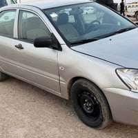 مسيبوشي لانسر موديل 2006 كير و محرك و تبريد سياره مصبوغه عام رقم بصره ...