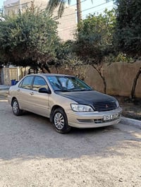 لانسر 2002 گیر و محرك بحاله جيدة تبريد شغال داخل نظيف مع دوشمة جديدة ت...