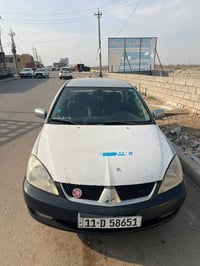 لانسر 2009 خليجي محرك 1.5  كير ابو زنجيل  داخل جديد على وضع شركه  كامل...