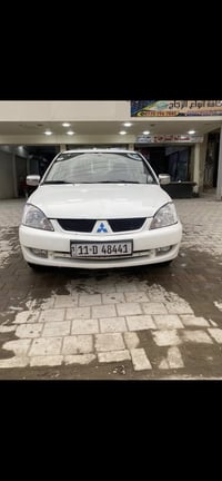 لانسر ٢٠٠٩ • ١٦٠٠ • رقم بغداد