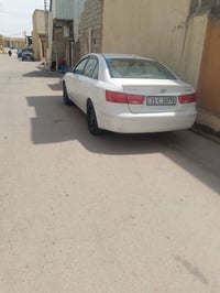 سوناتا 2010 وارد امريكا سياره ليبل واحد بدون حادث باسمي سعر ب115 وبيها...