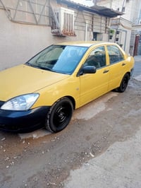سياره لانسر للبيع موديل 2010بسمي تبريد حداديه مكينه مكفوله صبغ فقط اله...