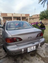 كورلاء موديل  2001 رقم بغداد ب اسمي شرط التحويل مكفوله كير ومحرك السعر...