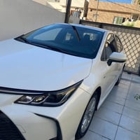 كورلا 2025  شكل خليجي محرك 1800 هايبرد HEV رقم بغداد السيارة داخل اسود...