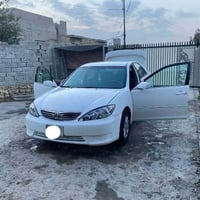 كامري ٢٠٠٦ • محرك ٤ مكفول • رقم بغداد