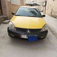 لانسر شركه عامه حره مامطلوبه هيئه غرامات مصفره موديل2010 محرك 2000  مع...